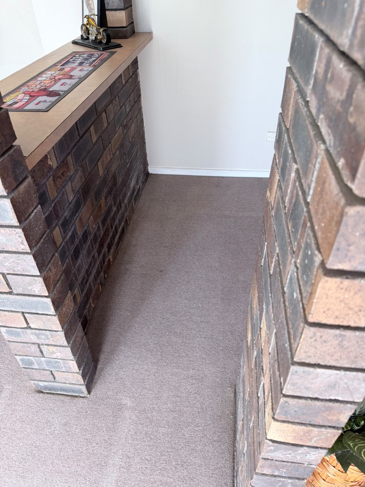 Carpet detail work around brickwork — after cleaning
