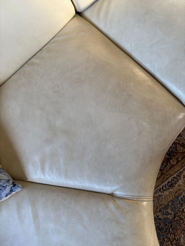 Cream leather corner sofa cushion before leather cleaning